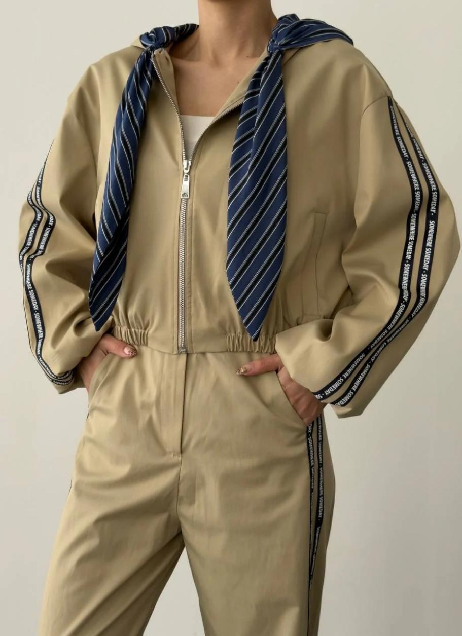 Beige hooded coordinated look from the Rhyme & Hype 2026 lookbook