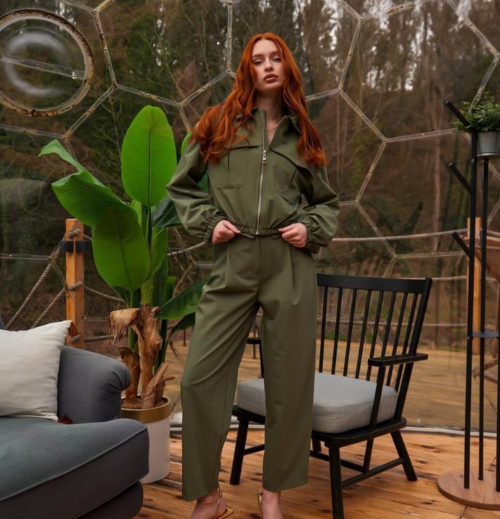 Model in olive green coordinated outfit