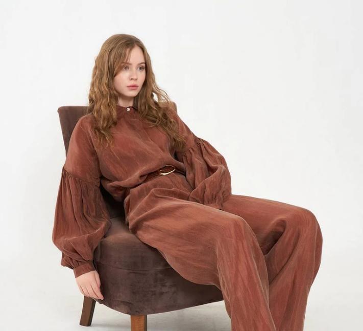 Seated model in brown coordinated set
